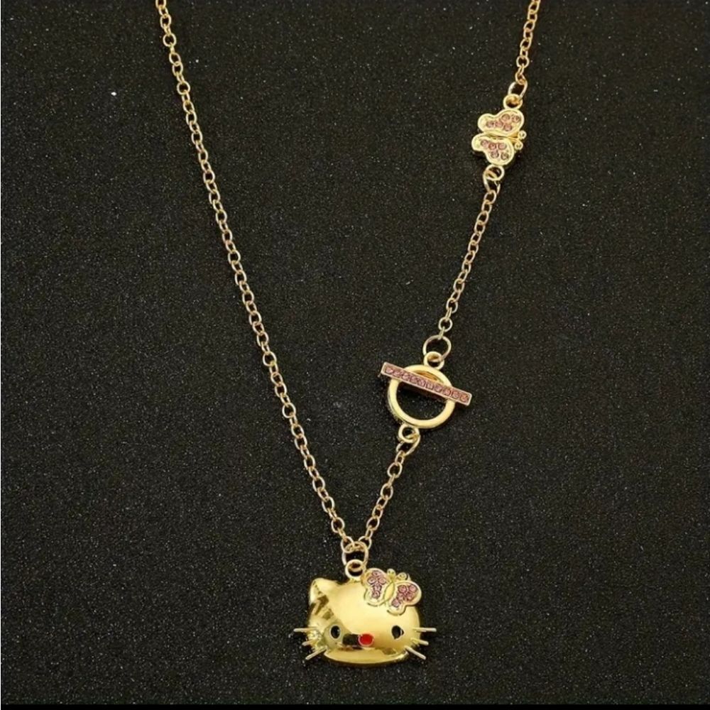 Gold-tone Hello Kitty Pendant Necklace with Pink Accents